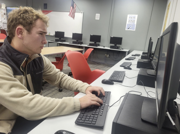 Sophomore Evan Hartman works on a coding project ion his computer.